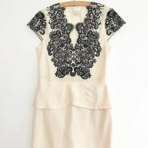 Esley Ivory and Black Lace Peplum Dress